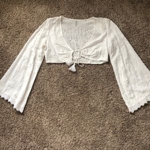 White, long sleeves, flair at wrist, crop top
